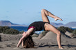 © Juan Algar - Slim woman in beautiful crab asana on beach
