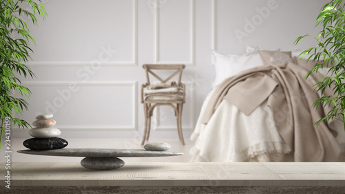 Fotomural White table shelf with pebble balance and bamboo plant over vintage classic bedr