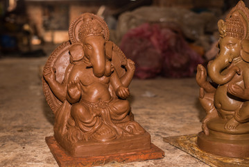 Wall Mural - Unfinished Clay model of Lord Ganesh\Ganesha being prepared by local artisans in India before the Hindu festival Ganesh Chaturthi 