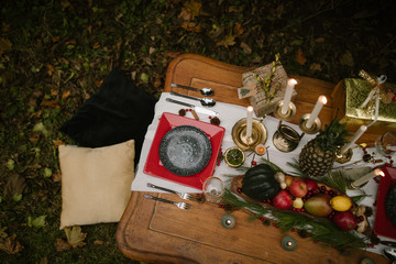 Wall Mural - christmas still life dinner party setting with fruits and candles