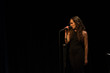 © stockmanushots - Pretty brunette girl singing