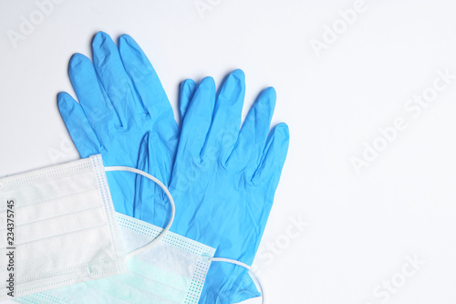 Photographie Flat lay composition with medical gloves on white background