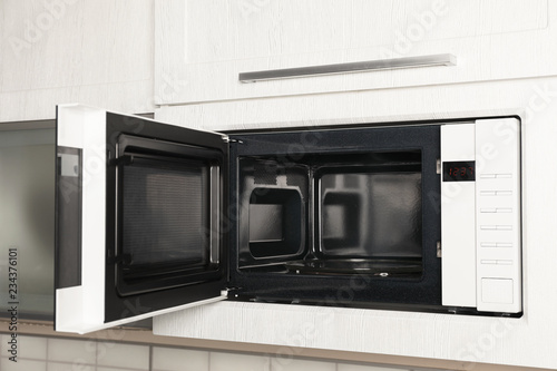 Fotografía Open modern microwave oven built in kitchen furniture