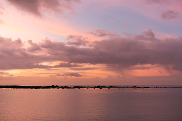 Aerial panoramic view of sunset over ocean.