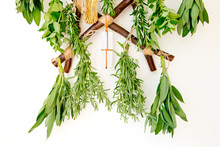 Fresh Herb Bundles Hanging With Selenite Crystal On Rustic Wooden Herb Dryer
