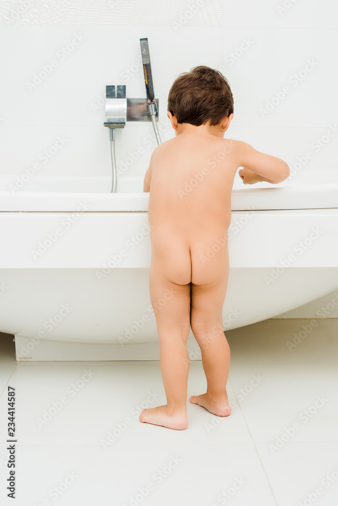 naked toddlers Nude toddler boy standing in white bathroom の Stock フォト | Adobe Stock