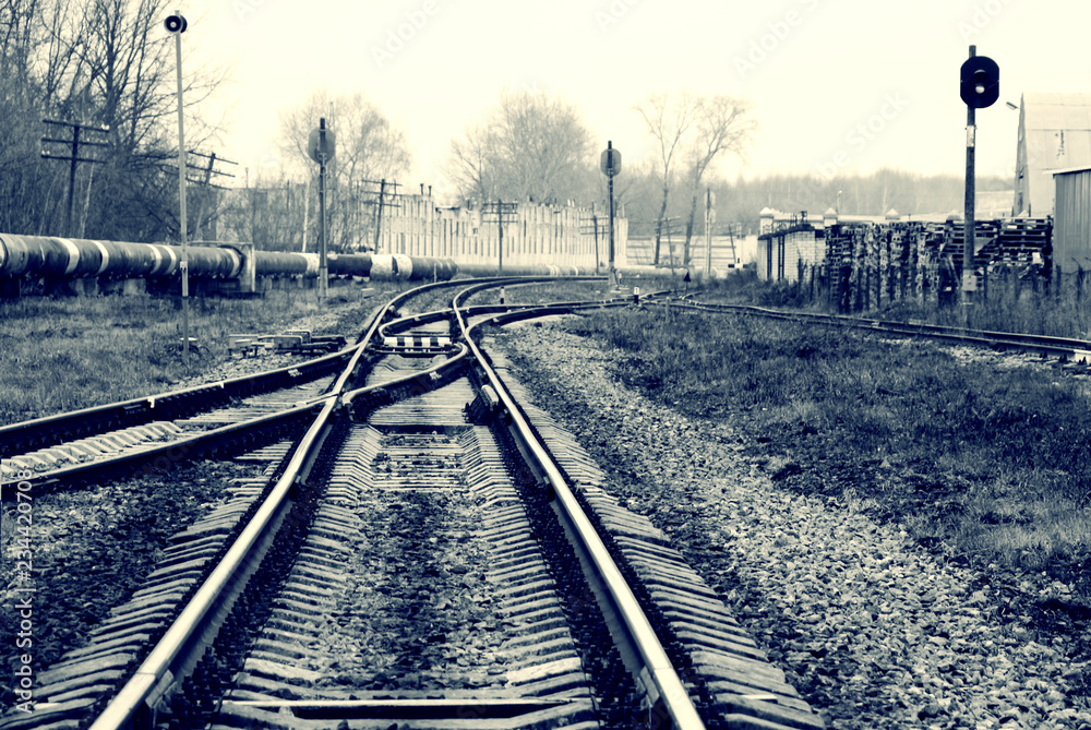 railway in the industrial zone..empty rails with a semaphore, in ...
