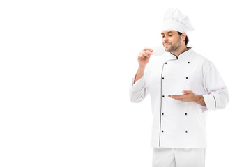 smiling male cook holding saucer and cup of coffee isolated on white