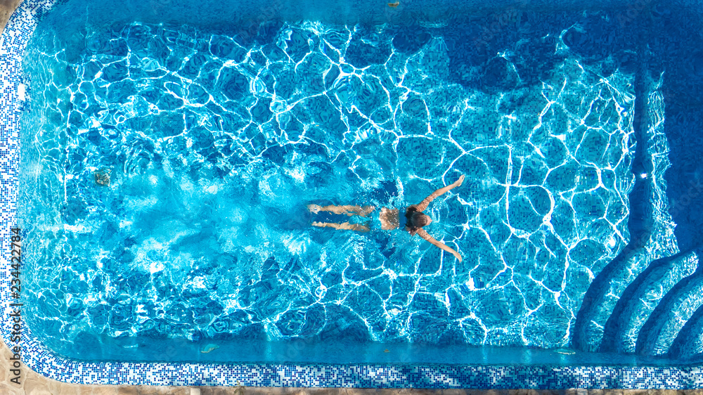 Active girl in swimming pool aerial drone view from above, young woman ...