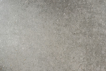 Grey textured granite surface with salt crystals