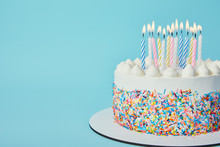 Delicious Birthday Cake With Lighting Candles On Blue Background