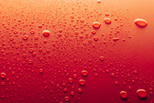 Water Drops On A Red Background