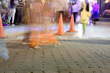 Wall Mural - Traffic Cone in a crowded city street, photography is taken with long exposure.