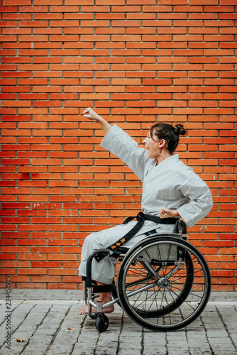 Fotografering Woman who training karate with wheelchair