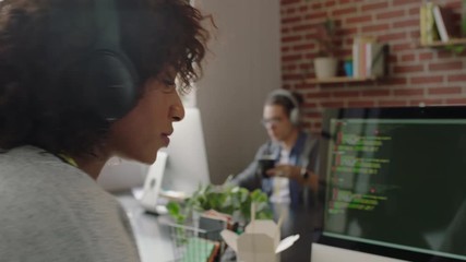 portrait african american woman programmer coding network security software for startup company professional web developer smiling enjoying typing code on computer screen in successful office 