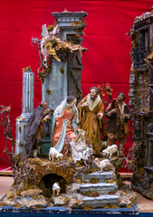 Decorating Christmas Nativity Scene, at the souvenir shop in Naples