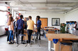 © Monkey Business - Group Of High School Students Standing Around Work Bench Listening To Teacher In Design And Technology Lesson