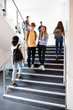 © Monkey Business - High School Students Walking On Stairs Between Lessons In Busy College Building