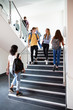 © Monkey Business - High School Students Walking On Stairs Between Lessons In Busy College Building