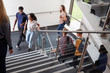 © Monkey Business - High School Students Walking On Stairs Between Lessons In Busy College Building