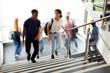 © Monkey Business - Motion Blur Shot Of High School Students Walking On Stairs Between Lessons In Busy College Building
