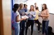 © Monkey Business - Excited Teenage High School Students Celebrating Exam Results In School Corridor