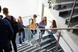 © Monkey Business - High School Students Walking On Stairs Between Lessons In Busy College Building