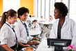© Monkey Business - High School Students Wearing Uniform Paying For Meal In Cafeteria
