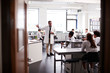 © Monkey Business - Male High School Tutor Teaching High School Students Wearing Uniforms In Science Class