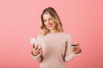 Wall Mural - Portrait of a happy young woman wearing sweater