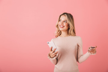 Canvas Print - Portrait of a happy young woman wearing sweater