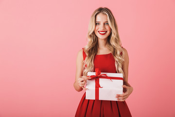 Poster - Portrait of a smiling young woman in red dress