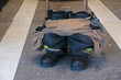 Close up of a prepared firefighter boots and uniform equipment