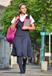 © dtiberio - Catholic School Girl Walking On Sidewalk