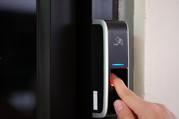 Aufkleber - close up of a man paste finger to biometric fingerprint scanner. security, door access control, vali