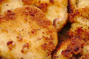 Fried breadcrumbs on meat