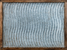 Texture Of Old Vintage Washboard In A Wooden Frame.Wavy Pattern, Ribbed, Goffered Galvanized Sheet Metal.