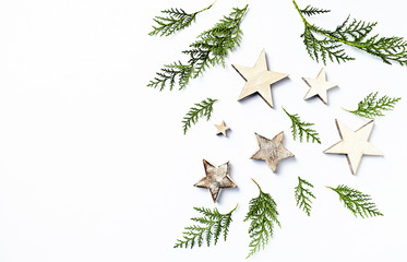 Wall Mural - An arrangement of evergreen twigs and Christmas decorations. Flatlay. Copy space. White background