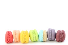 Line Of Colorful Fresh Sweet Cake Macaroons On The White Background, Have Copy Space For Put Text. Rainbow Color.