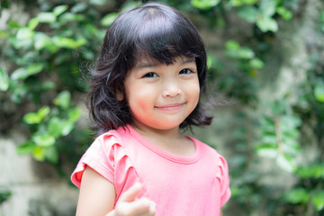 Happy Asian cute girl or kid smiling with happiness. face expression concept.