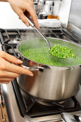 Canvas Print - WOMAN IN KITCHEN COOKING PEAS