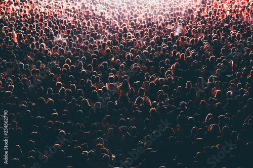 Fotografía Colorful crowd of people of a big music festival in a stage lights as a beautifu