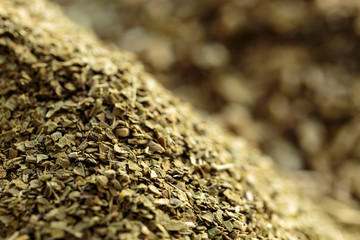 Yerba mate (Ilex paraguariensis) without stems in foreground, close-up