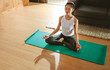 © Jacob Lund - Healthy woman exercising yoga in living room