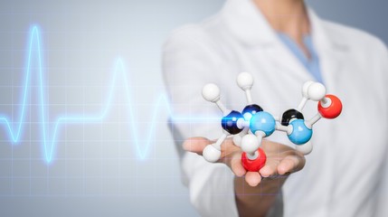 Wall Mural - Close up of Molecular structure model in hand on background