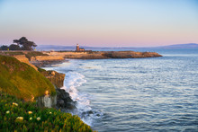 Sunset View Of The Pacific Ocean Rugged Coastline, Santa Cruz, California; Santa Cruz Surfing Museum In The Background