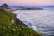 Sunset View Of The Pacific Ocean Rugged Coastline; Santa Cruz Surfing Museum In The Background; California
