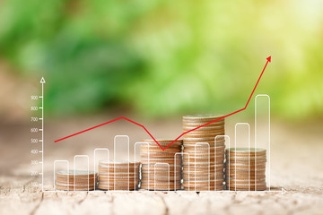 Stack of coins and growing graph for business finance concept