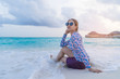 © mikumistock - Asian beautiful woman enjoyful traveling sea background.