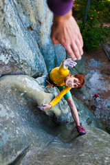 Wall Mural - Rock-climber gives five.